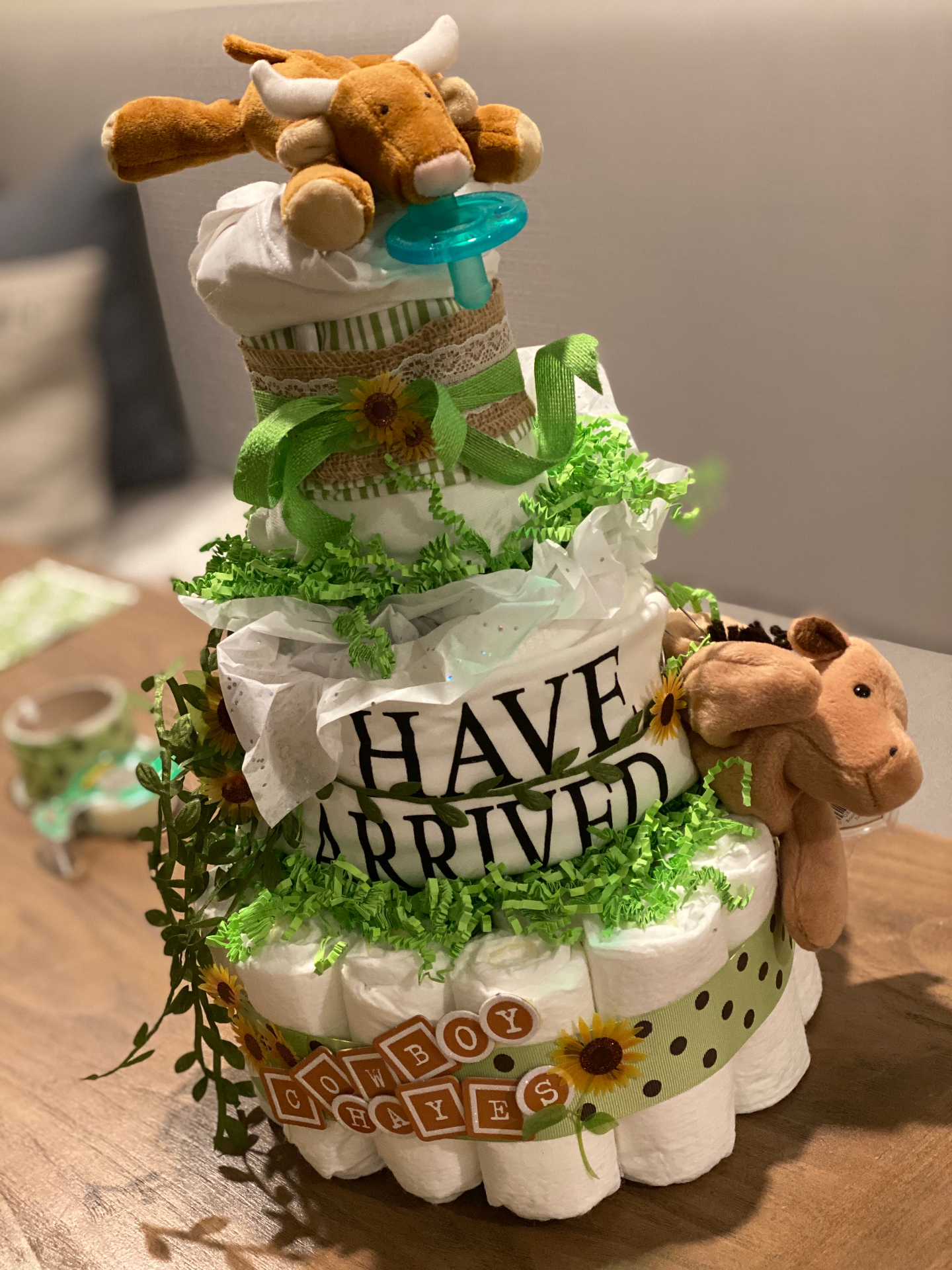 "Have Arrived" cowboy-themed diaper cake
