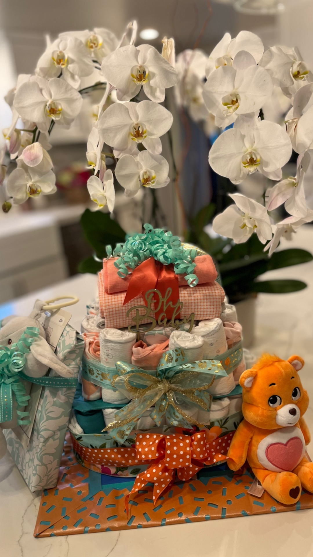 "Oh Baby" diaper cake with orchid arrangement