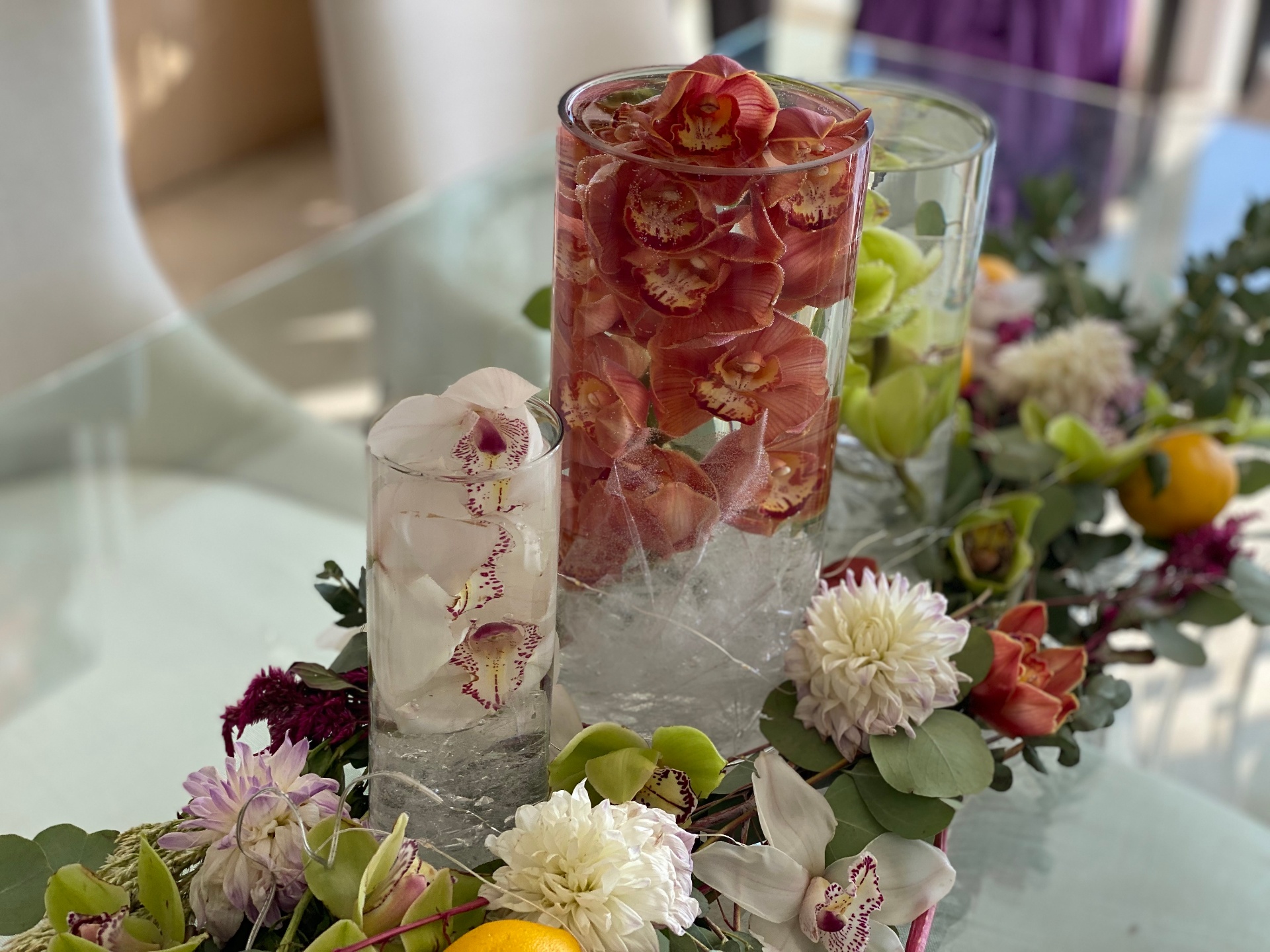 Submerged cymbidium orchids with dahlia garland