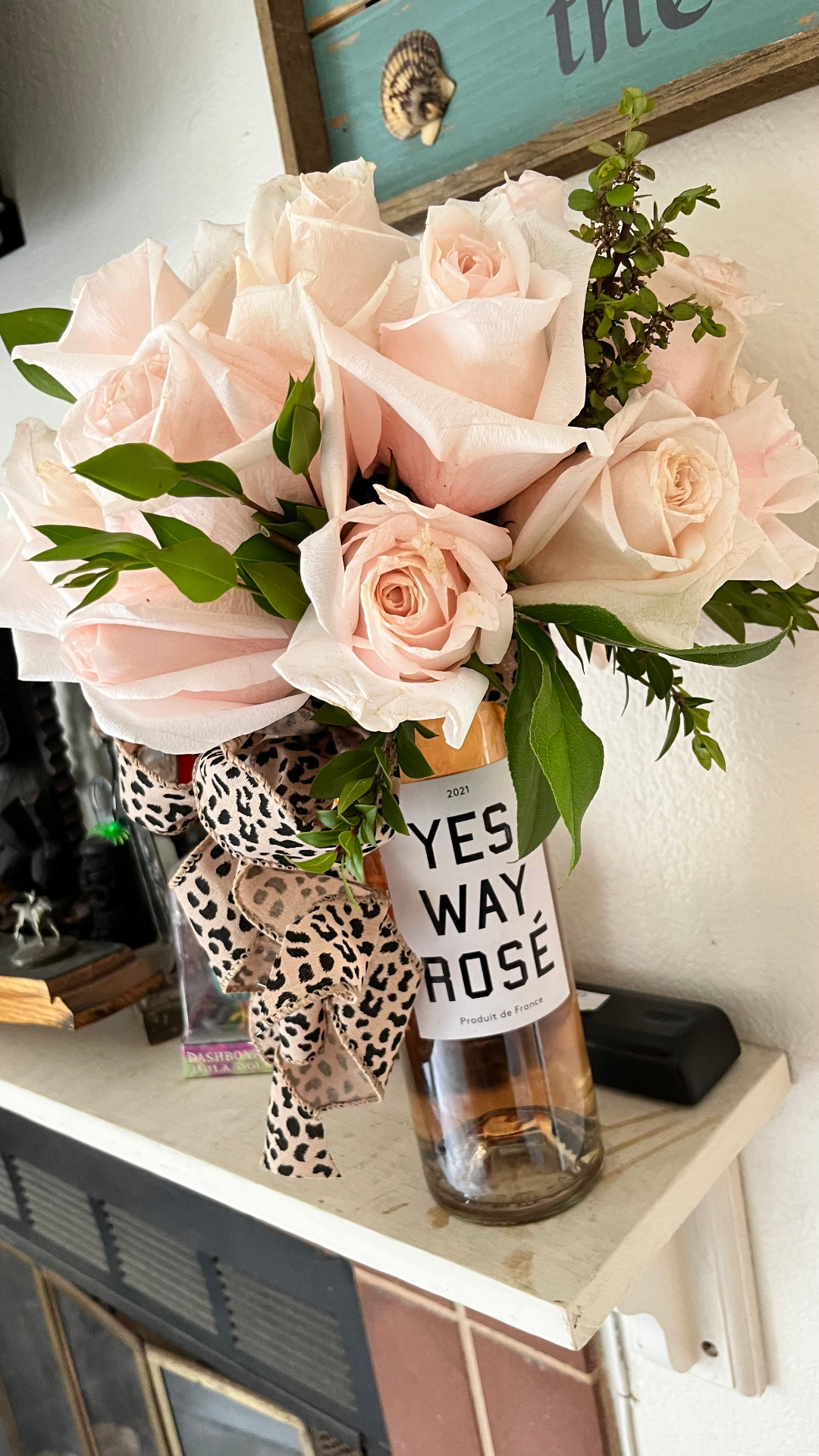 Blush roses in a Yes Way RosΓ© bottle