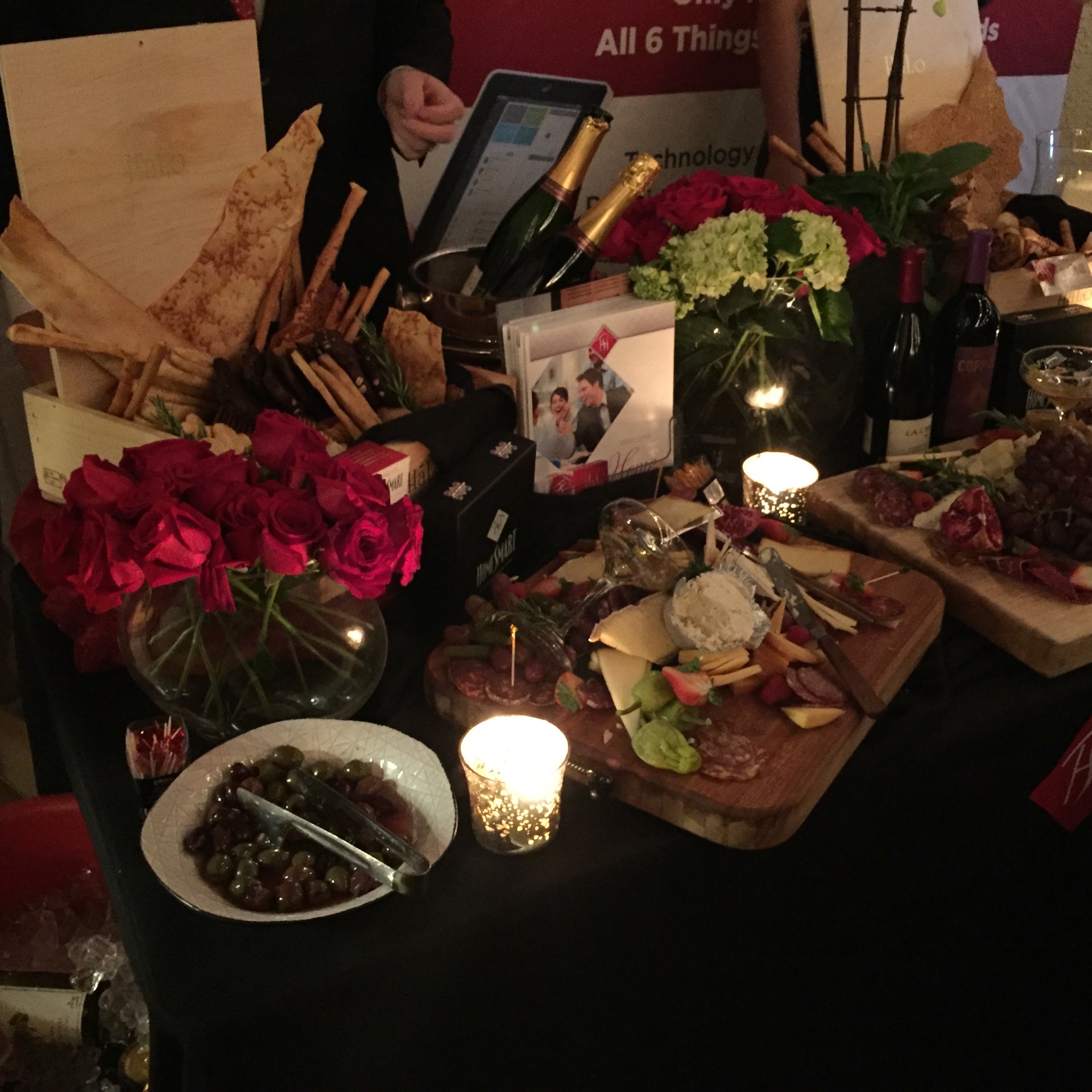 HomeSmart brand booth β florals, charcuterie & champagne