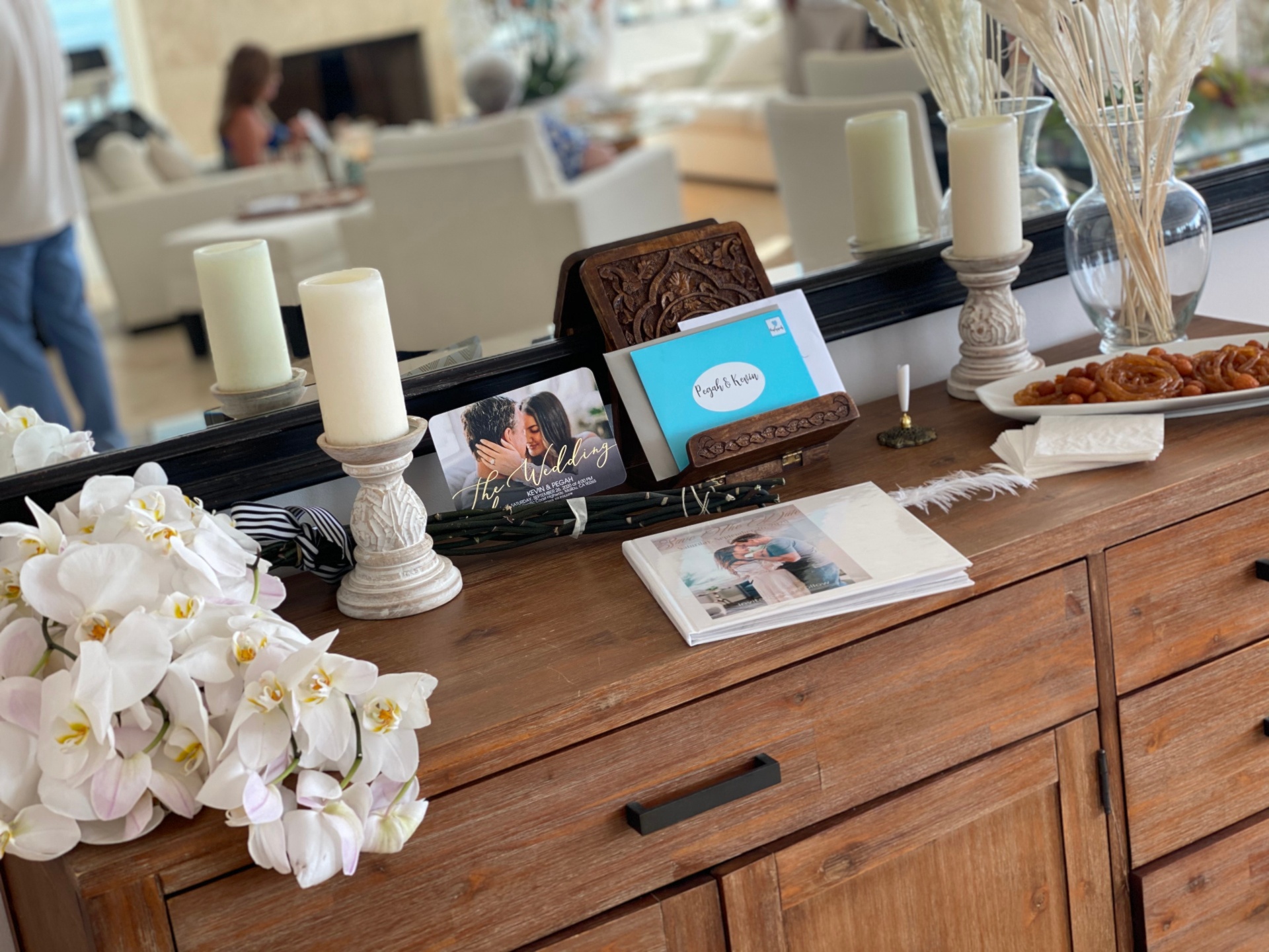 Wedding welcome table β orchids, candles & guest book